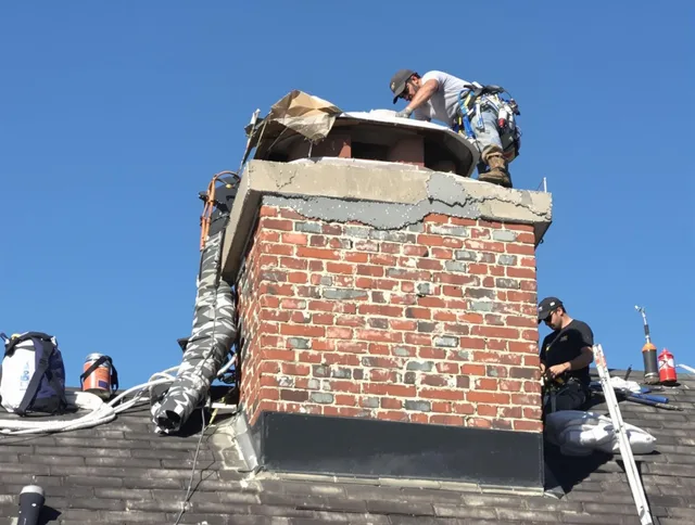 East Lyme Chimney Sweep installing a custom chimney crown in East Lyme, CT