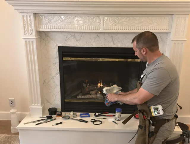 East Lyme Chimney Sweep performing fireplace maintenance in East Lyme, CT