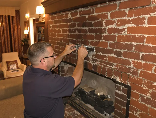 East Lyme Chimney Sweep expert fixing a fireplace in East Lyme, CT